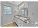 Bright bathroom featuring double vanity sinks, granite-style counters, and great natural light at 1650 Berkshire Dr, Hickory, NC 28602