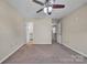 Spacious bedroom with ceiling fan and view of attached bathroom at 1650 Berkshire Dr, Hickory, NC 28602