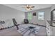 Spare bedroom boasts two sunny windows and a ceiling fan at 1650 Berkshire Dr, Hickory, NC 28602