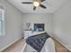 Cozy bedroom featuring a ceiling fan, natural light, and neutral paint at 1650 Berkshire Dr, Hickory, NC 28602