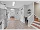 Bright kitchen boasts tile floors, stainless steel appliances, and a stylish sliding barn door at 1650 Berkshire Dr, Hickory, NC 28602