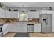 Well-equipped kitchen featuring stainless steel appliances and tiled backsplash at 1650 Berkshire Dr, Hickory, NC 28602