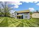 Expansive backyard featuring a well-maintained lawn and a covered patio, perfect for outdoor entertaining at 20422 Creek Bend Edge Ct, Matthews, NC 28105