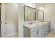 Bathroom features a double vanity with two mirrors, providing ample space and modern elegance at 20422 Creek Bend Edge Ct, Matthews, NC 28105