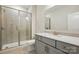 Bathroom featuring a glass shower, tiled floors, and updated sink and vanity at 20422 Creek Bend Edge Ct, Matthews, NC 28105