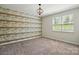 Bedroom features accent wall, neutral carpet, and a window to let in natural light at 20422 Creek Bend Edge Ct, Matthews, NC 28105