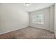 Carpeted bedroom is well-lit, spacious, and ready for personal touches at 20422 Creek Bend Edge Ct, Matthews, NC 28105