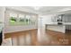 Open floorplan with hardwood floors that connect the living room with fireplace to the kitchen at 20422 Creek Bend Edge Ct, Matthews, NC 28105