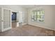 The living room area includes double doors and large windows with views of the street at 20422 Creek Bend Edge Ct, Matthews, NC 28105