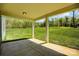 Covered patio overlooking a large grassy backyard, providing an ideal outdoor retreat with scenic views at 20422 Creek Bend Edge Ct, Matthews, NC 28105