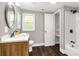 Bathroom with a wood vanity, white countertops, shower and storage at 212 W Doc Garris Rd, Lancaster, SC 29720