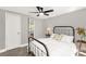 Bedroom with a ceiling fan and light neutral walls and carpet with bright doors and trim at 212 W Doc Garris Rd, Lancaster, SC 29720