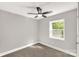 Bright bedroom featuring neutral walls, carpet floors, ceiling fan and bright windows at 212 W Doc Garris Rd, Lancaster, SC 29720
