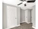 Bedroom featuring neutral walls, carpet floors, ceiling fan and bright white doors at 212 W Doc Garris Rd, Lancaster, SC 29720