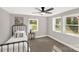Cozy bedroom featuring neutral walls, carpet floors, ceiling fan and bright windows at 212 W Doc Garris Rd, Lancaster, SC 29720