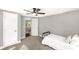 Bedroom with a ceiling fan and light neutral walls and carpet with bright doors and trim at 212 W Doc Garris Rd, Lancaster, SC 29720