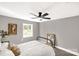 Bright bedroom featuring neutral walls, carpet floors, ceiling fan and bright windows at 212 W Doc Garris Rd, Lancaster, SC 29720