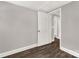 Neutral bedroom offers wood-look flooring, gray walls, and white trim at 212 W Doc Garris Rd, Lancaster, SC 29720
