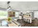 Bright dining area connected to a modern kitchen with butcher block island and stainless steel appliances at 212 W Doc Garris Rd, Lancaster, SC 29720