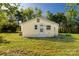 Quaint yellow house with white trim and a well-maintained lawn at 212 W Doc Garris Rd, Lancaster, SC 29720