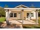 Charming front porch with seating area offers a welcoming entrance to this cozy home at 212 W Doc Garris Rd, Lancaster, SC 29720