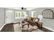 Bright living room features a comfortable sofa, neutral decor, lots of light, and stylish accents at 212 W Doc Garris Rd, Lancaster, SC 29720