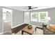 Inviting living room with lots of natural light, a ceiling fan, and comfortable seating arrangement at 212 W Doc Garris Rd, Lancaster, SC 29720