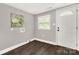 Charming mud room features wood-look flooring and white exterior door with a window at 212 W Doc Garris Rd, Lancaster, SC 29720
