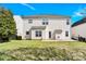 A spacious backyard with a lush lawn, defined concrete patio, and perimeter fencing at 2275 Laurens Dr, Concord, NC 28027