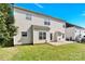 Home's backyard, featuring a well-maintained lawn with partial fencing, and concrete patio at 2275 Laurens Dr, Concord, NC 28027