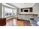 Stylish bar area with stone accents, custom cabinets, and hardwood flooring at 2275 Laurens Dr, Concord, NC 28027