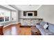 Stylish bar area with stone accents, custom cabinets, and hardwood flooring at 2275 Laurens Dr, Concord, NC 28027