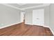 Bright bedroom with hardwood floors and ample closet space at 2275 Laurens Dr, Concord, NC 28027
