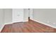 Bedroom featuring hardwood floors and double doors at 2275 Laurens Dr, Concord, NC 28027