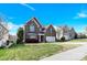 Beautiful two-story brick home with a manicured lawn, two car garage and inviting curb appeal at 2275 Laurens Dr, Concord, NC 28027