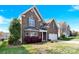 Charming two-story brick home with a two-car garage and well-maintained landscaping at 2275 Laurens Dr, Concord, NC 28027