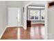 Welcoming foyer featuring hardwood floors, a front door with sidelight, and a view into the sitting area at 2275 Laurens Dr, Concord, NC 28027