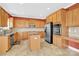 Spacious kitchen boasts stainless steel appliances, granite countertops, and custom cabinetry at 2275 Laurens Dr, Concord, NC 28027