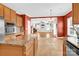Open-concept kitchen overlooking the living area, featuring granite countertops and stainless appliances at 2275 Laurens Dr, Concord, NC 28027