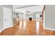 Bright and airy living room featuring gleaming hardwood floors, a cozy fireplace, and ample natural light at 2275 Laurens Dr, Concord, NC 28027