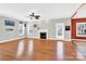 Spacious living room featuring hardwood floors, a fireplace, and plenty of natural light through large windows at 2275 Laurens Dr, Concord, NC 28027