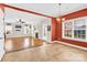 Open-concept living and dining area featuring hardwood floors, fireplace, and abundant natural light at 2275 Laurens Dr, Concord, NC 28027