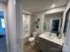 The bathroom is newly built with a shower and tub combination and modern sink and countertop at 248 Laura Elizabeth Ln, Clover, SC 29710