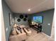 Cozy bonus room with a plush sofa, entertainment center, and stylish decor at 248 Laura Elizabeth Ln, Clover, SC 29710
