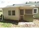 View of back exterior features siding, screened door and window and set on natural landscape at 2547 Gastonia Hwy, Lincolnton, NC 28092