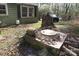Home exterior with green siding and white-trimmed windows nestled amongst mature trees at 2547 Gastonia Hwy, Lincolnton, NC 28092