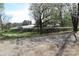 A tree-lined street with a vintage church in the background at 2547 Gastonia Hwy, Lincolnton, NC 28092