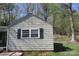 Exterior shot of a cottage-style home, highlighting the vintage windows and simple architectural details at 2547 Gastonia Hwy, Lincolnton, NC 28092