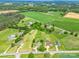 Wide aerial shot of the property nestled among lush greenery and neighboring homes at 2614 Reepsville Rd, Lincolnton, NC 28092