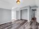 Bedroom featuring light blue walls, hard surface floors, closet and natural light at 2614 Reepsville Rd, Lincolnton, NC 28092